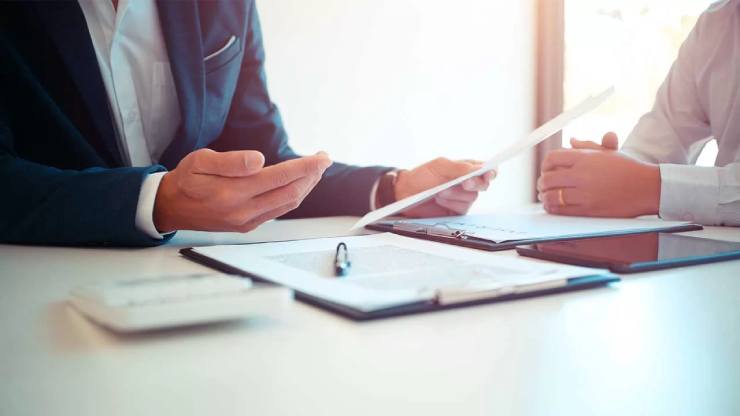 two people reviewing paperwork